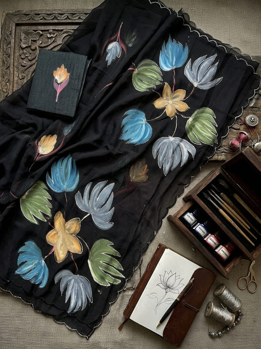 Elegant Hand-Painted Organza Saree with Artistic Floral Motifs
